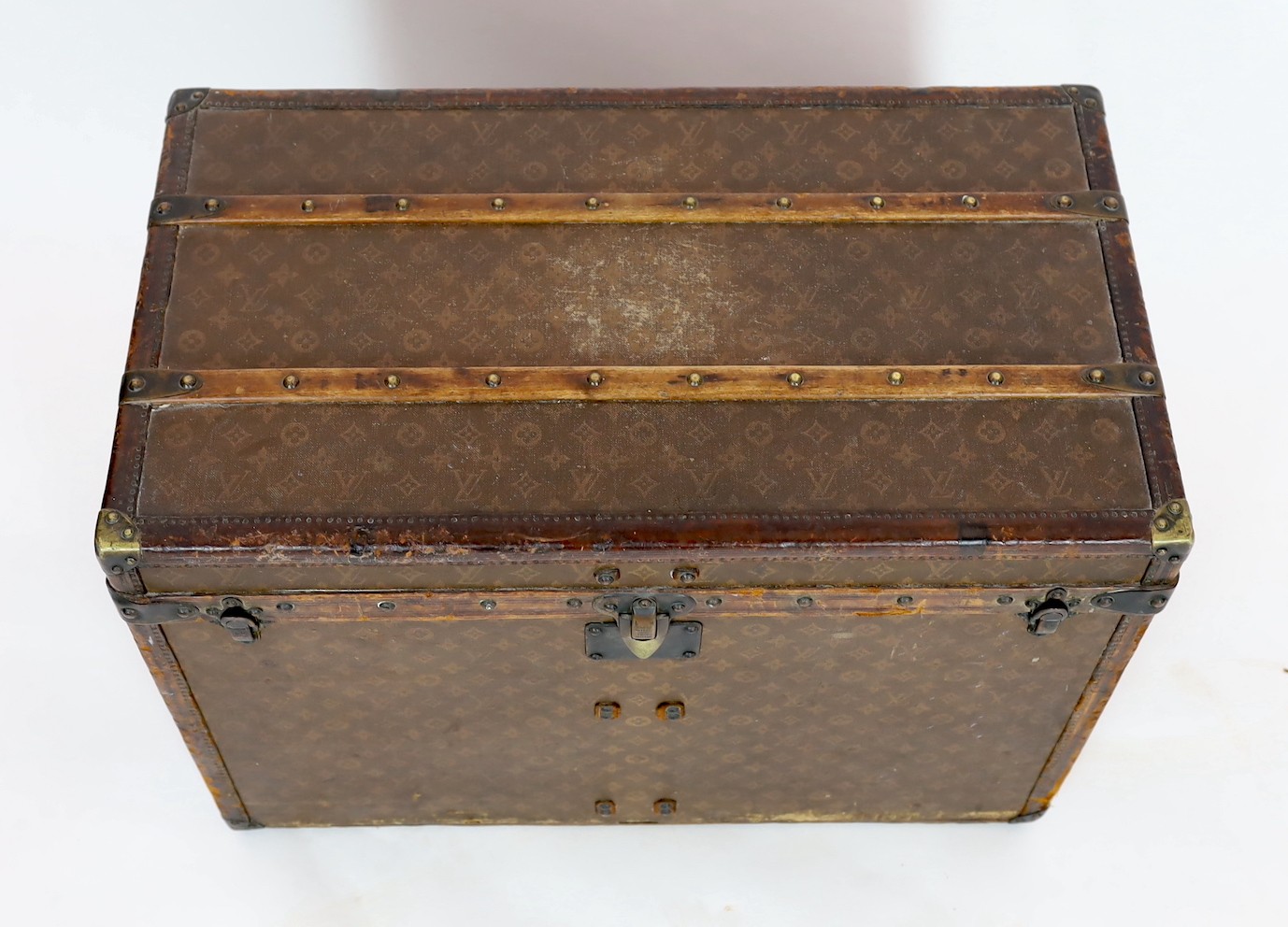 A Louis Vuitton brass mounted leather bound trunk, c.1910, numbered 137426, 75cm wide, 43cm deep, 54cm high